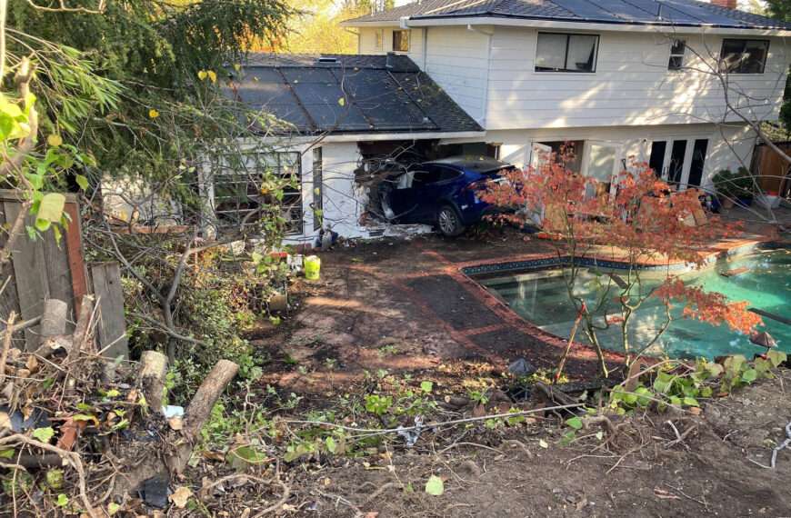 Horror As Tesla Soars Over Pool And Into Home’s Kitchen